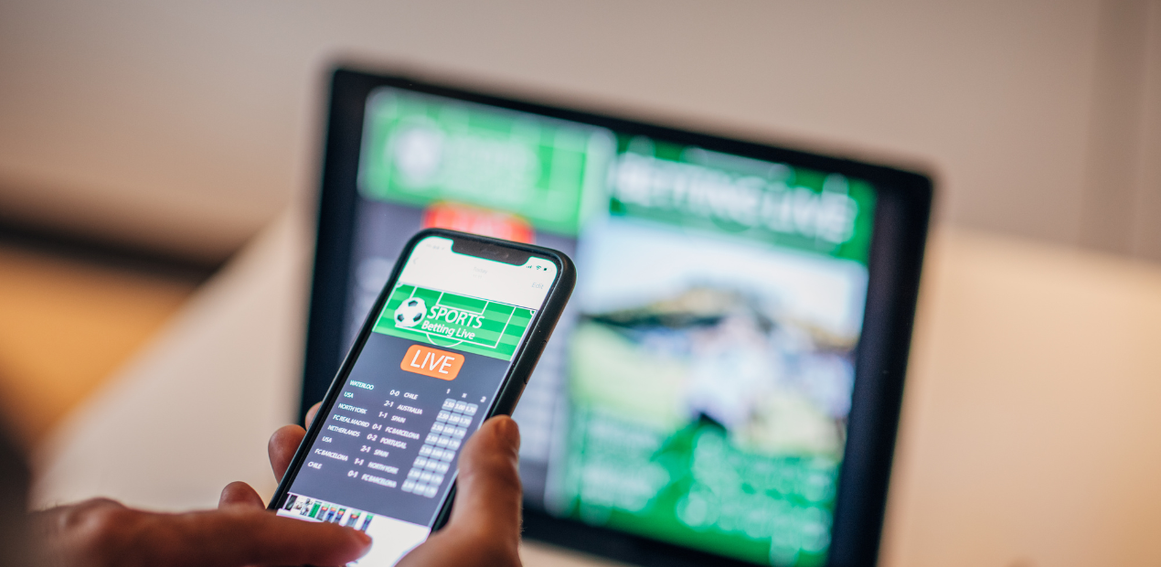 Aplicativo de apostas esportivas no celular ilustrando o vício em jogos de aposta e bets online